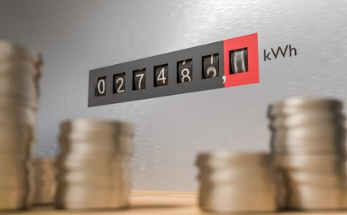 Expensive energy and power consumption concept. Coins in front of electricity meter.